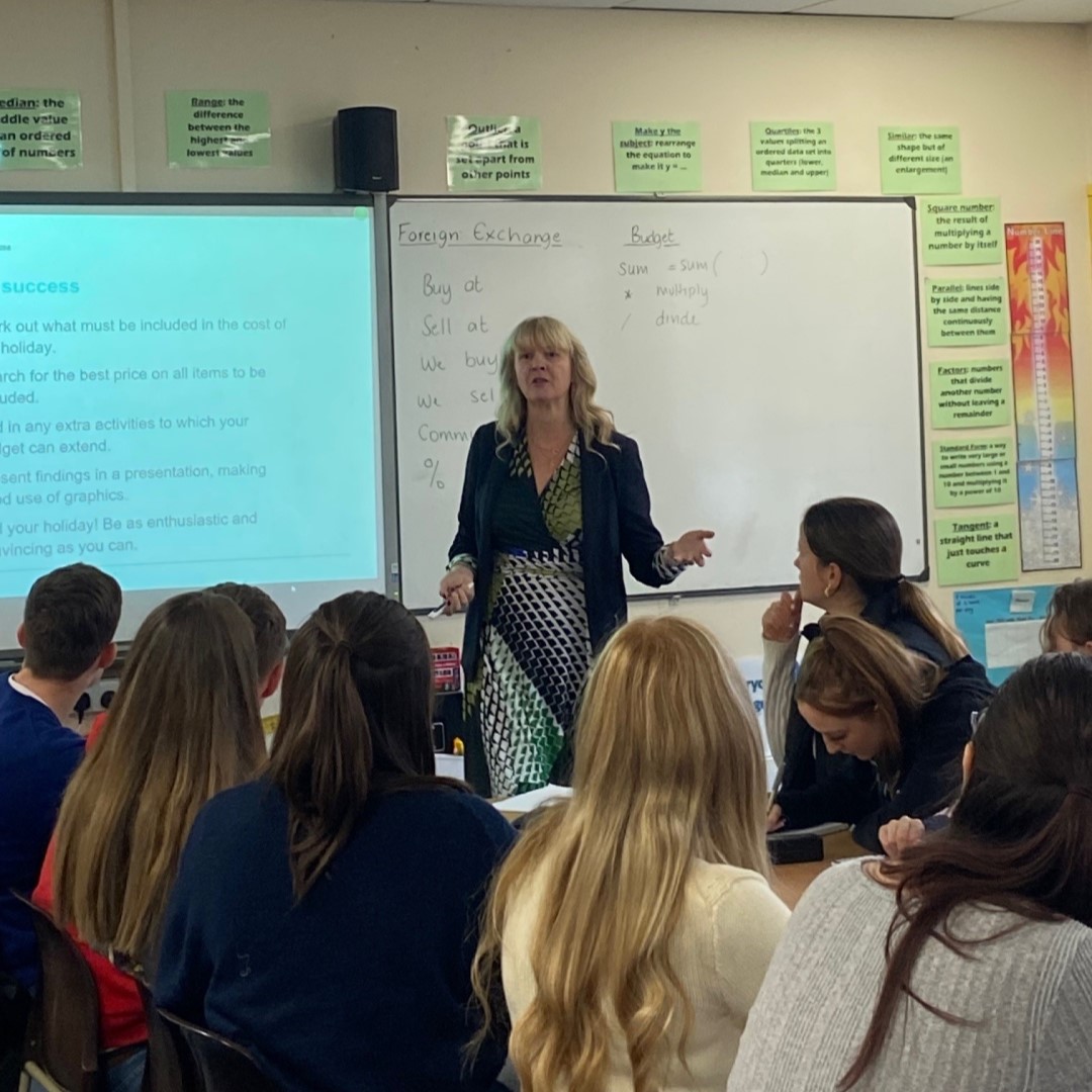 Article Image 1 Teacher In Front Of Whiteboard Facing Students